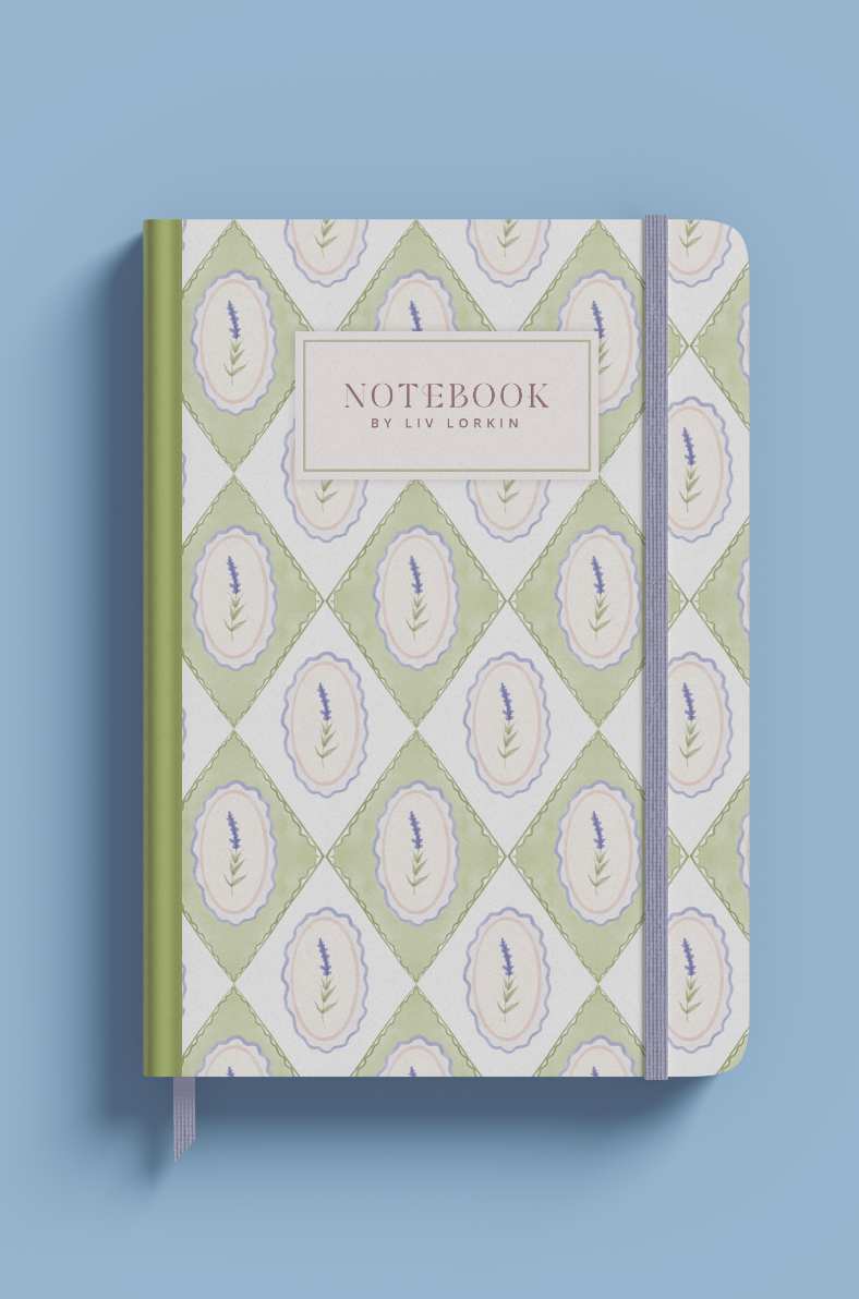 Small notebook with purple floral pattern in diamond shapes on blue background by Liv Lorkin, with green spine and beautiful font, ideal for personal or professional use.